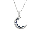 White gold crescent pendant with blue sapphires and diamond accents
