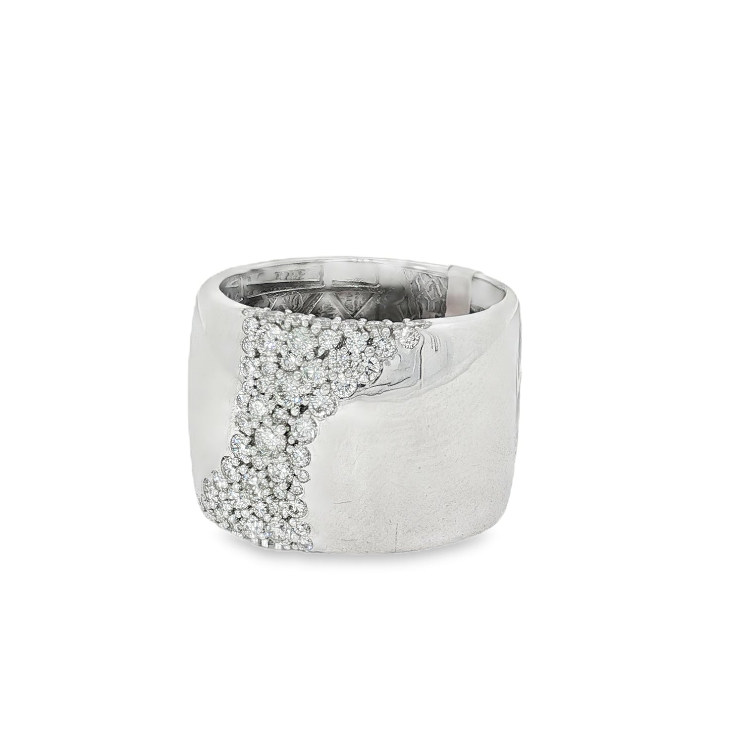 Angled view of wide white gold ring and diagonal pavé setting