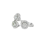 Side view showing pear and round diamond clusters on open ring