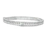 White gold bangle with parallel baguette and round diamond rows