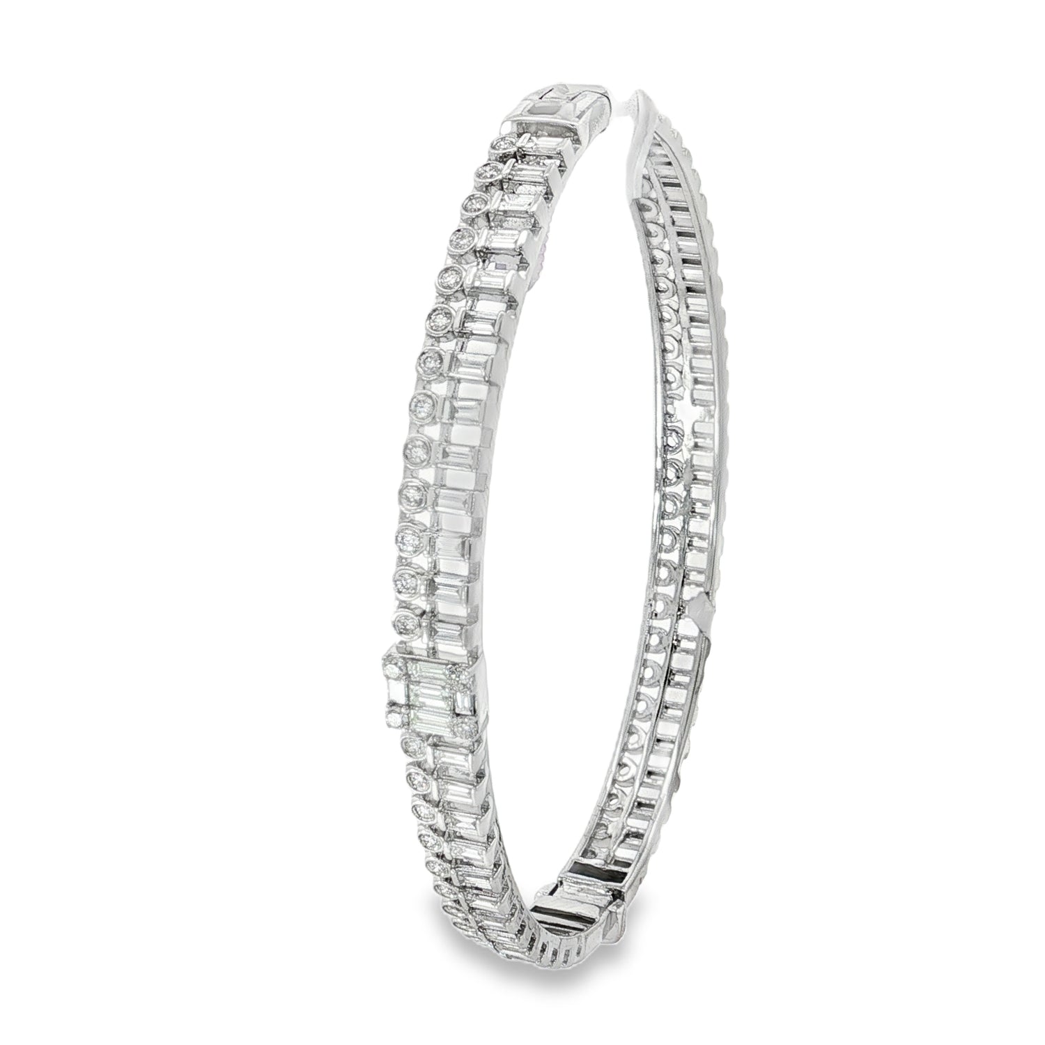 Side view showing hinged white gold bangle and diamond rows