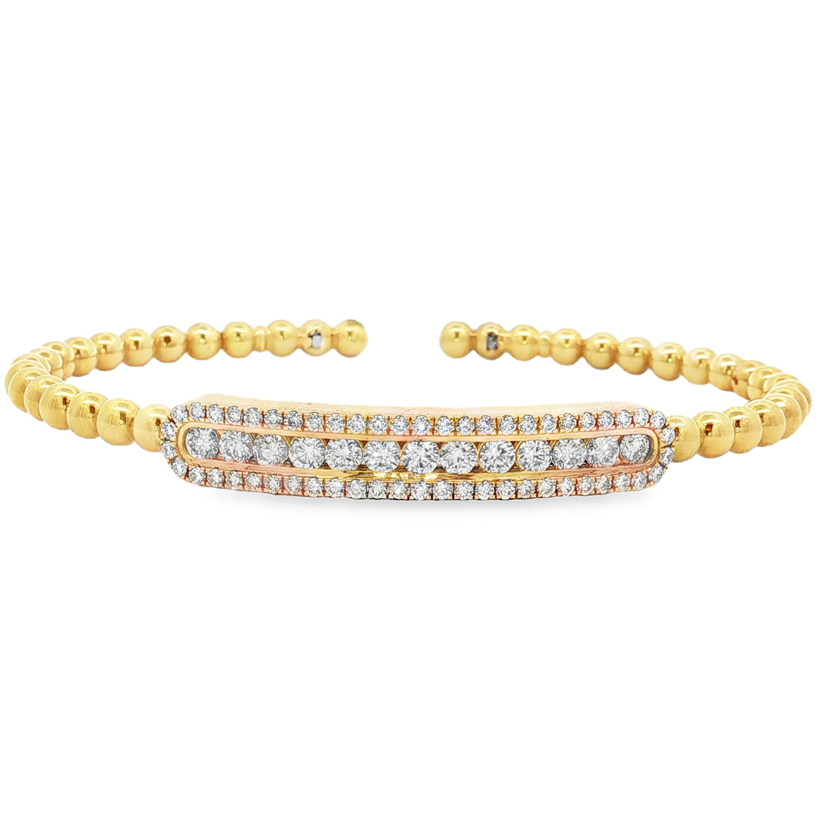 Yellow gold beaded bangle with elongated round diamond station