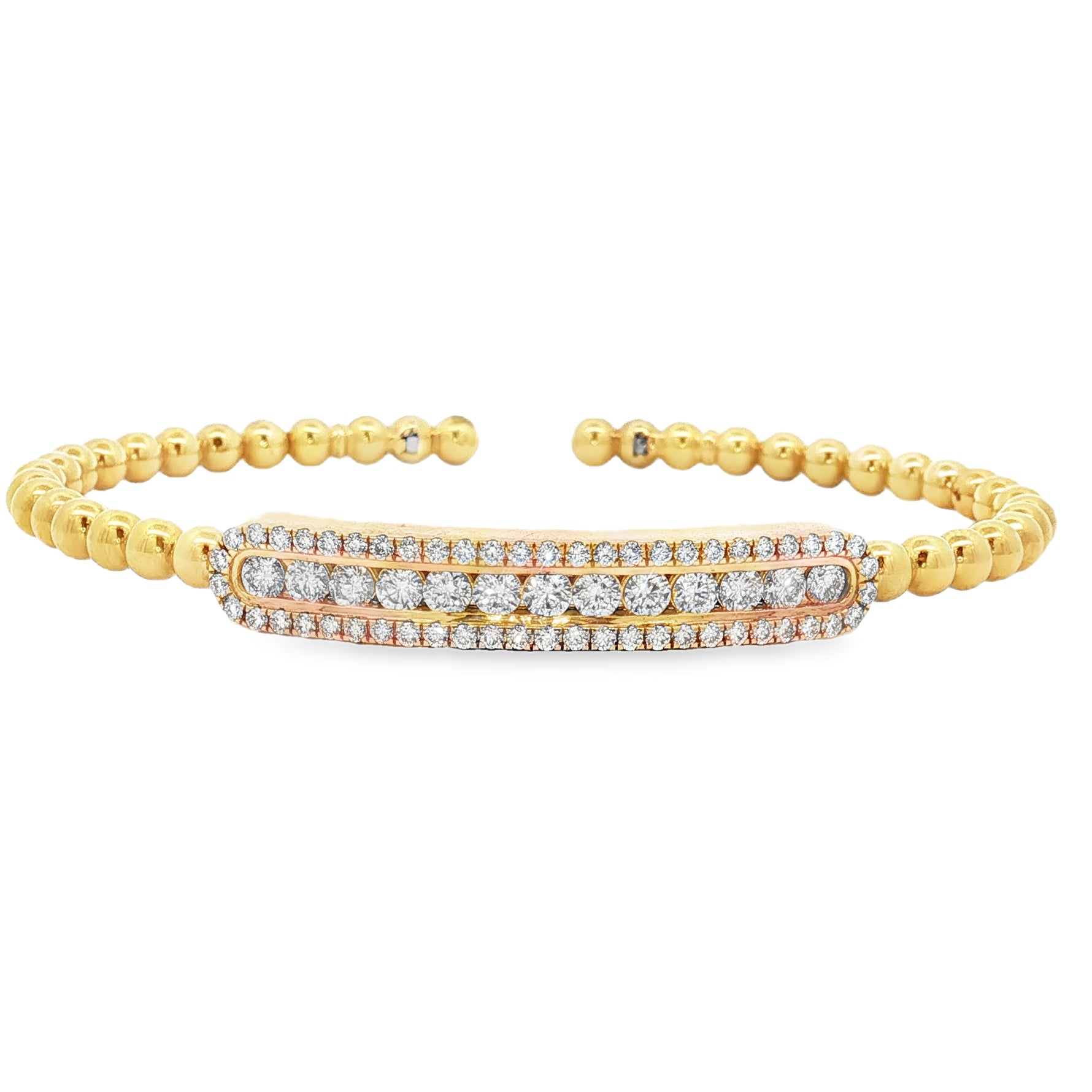 Yellow gold beaded bangle with elongated round diamond station