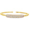 Yellow gold beaded bangle with elongated round diamond station