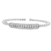 White gold beaded bangle with elongated round diamond station