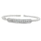White gold beaded bangle with elongated round diamond station