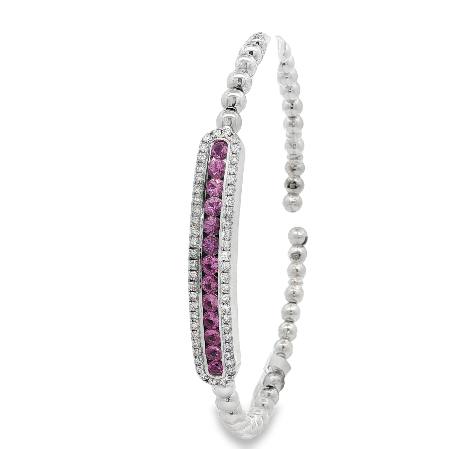 Side view showing pink sapphire row within diamond-bordered station