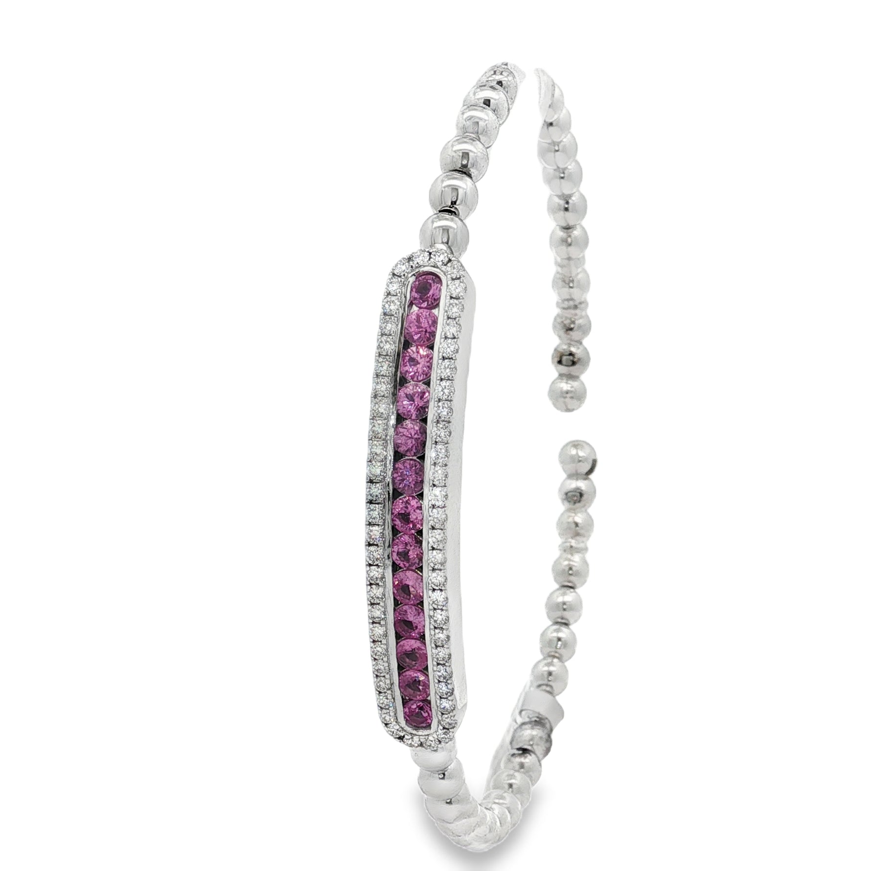 Side view showing pink sapphire row within diamond-bordered station
