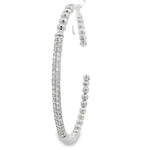Angled view of beaded open bangle and pavé diamond centerpiece