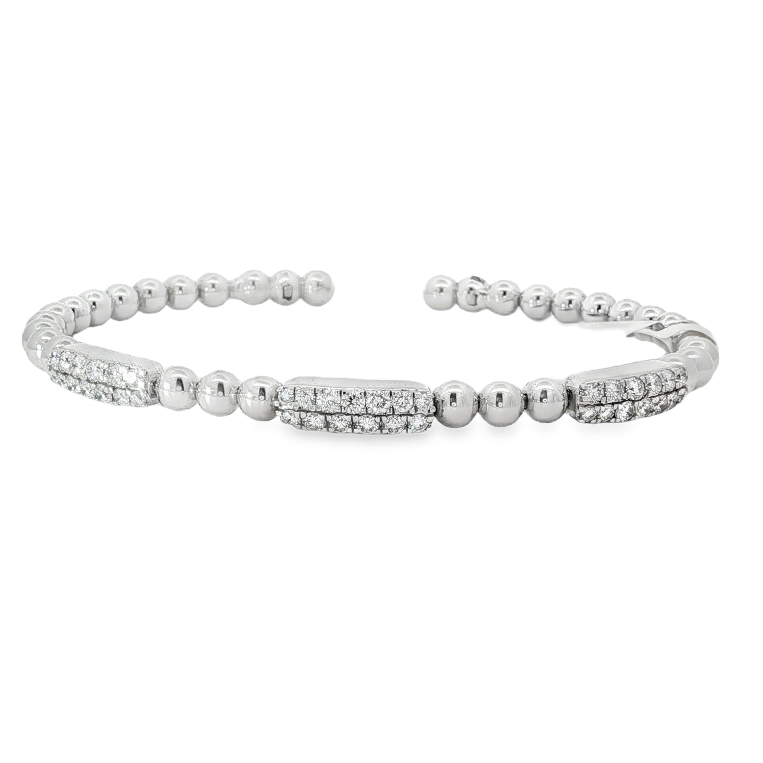 White gold open bangle with three round diamond stations