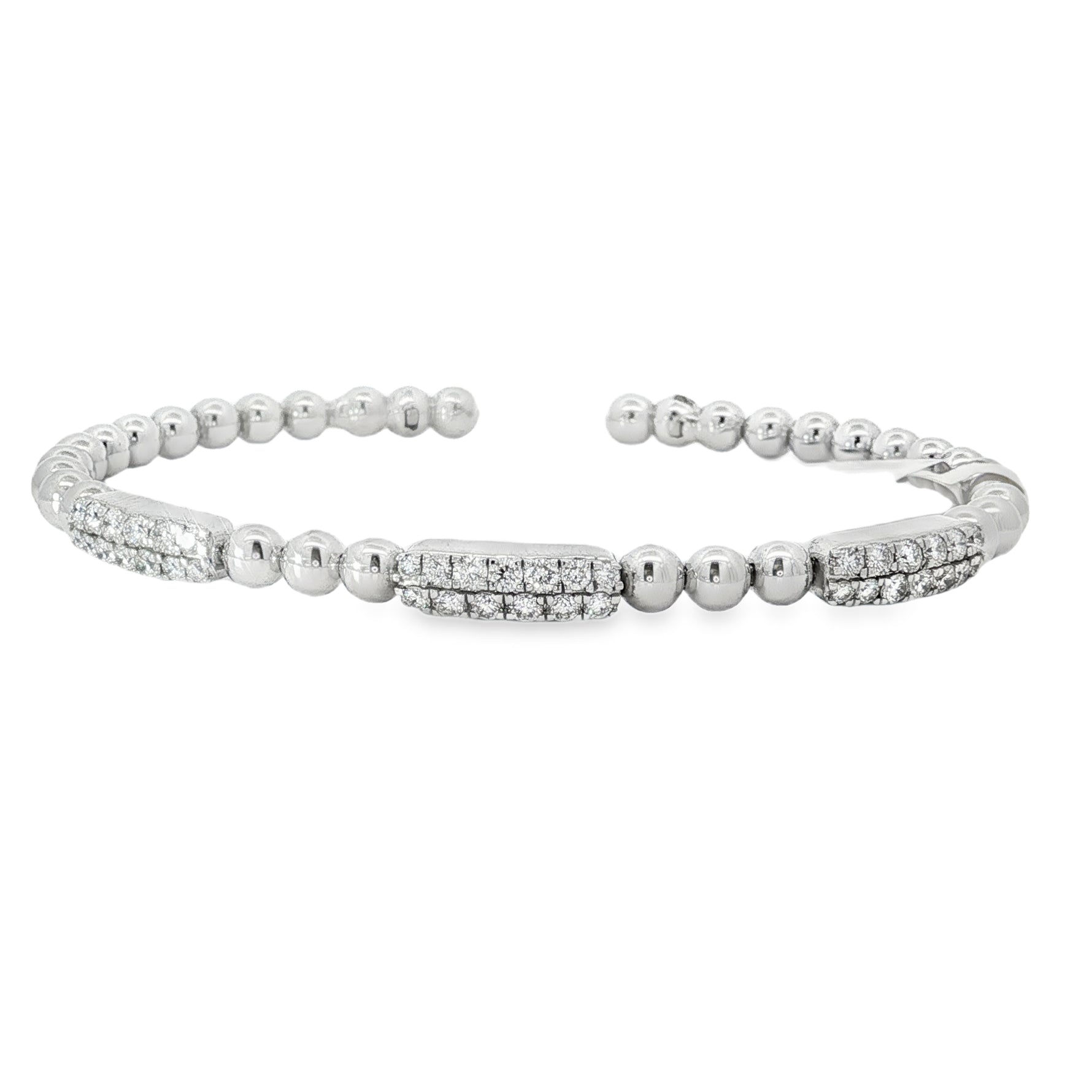 White gold open bangle with three round diamond stations