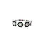 White gold band ring with black hexagonal frames and diamond centers