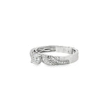 Angled view showing braided pavé bands and raised diamond cluster
