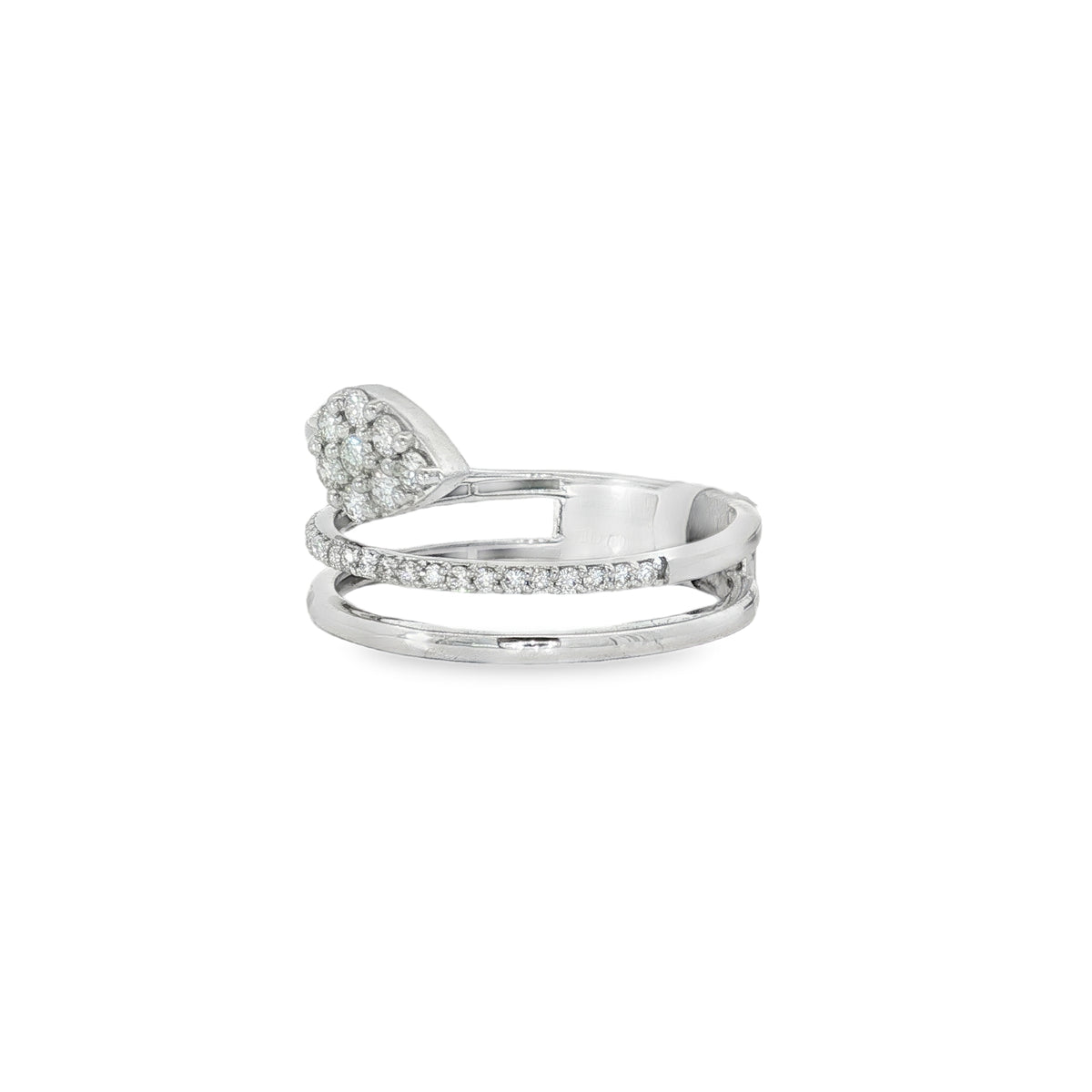 Side view of pear diamond cluster above layered white gold bands