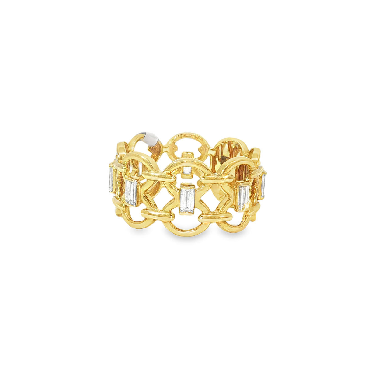 Angled view of interlocking yellow gold links and baguette diamonds