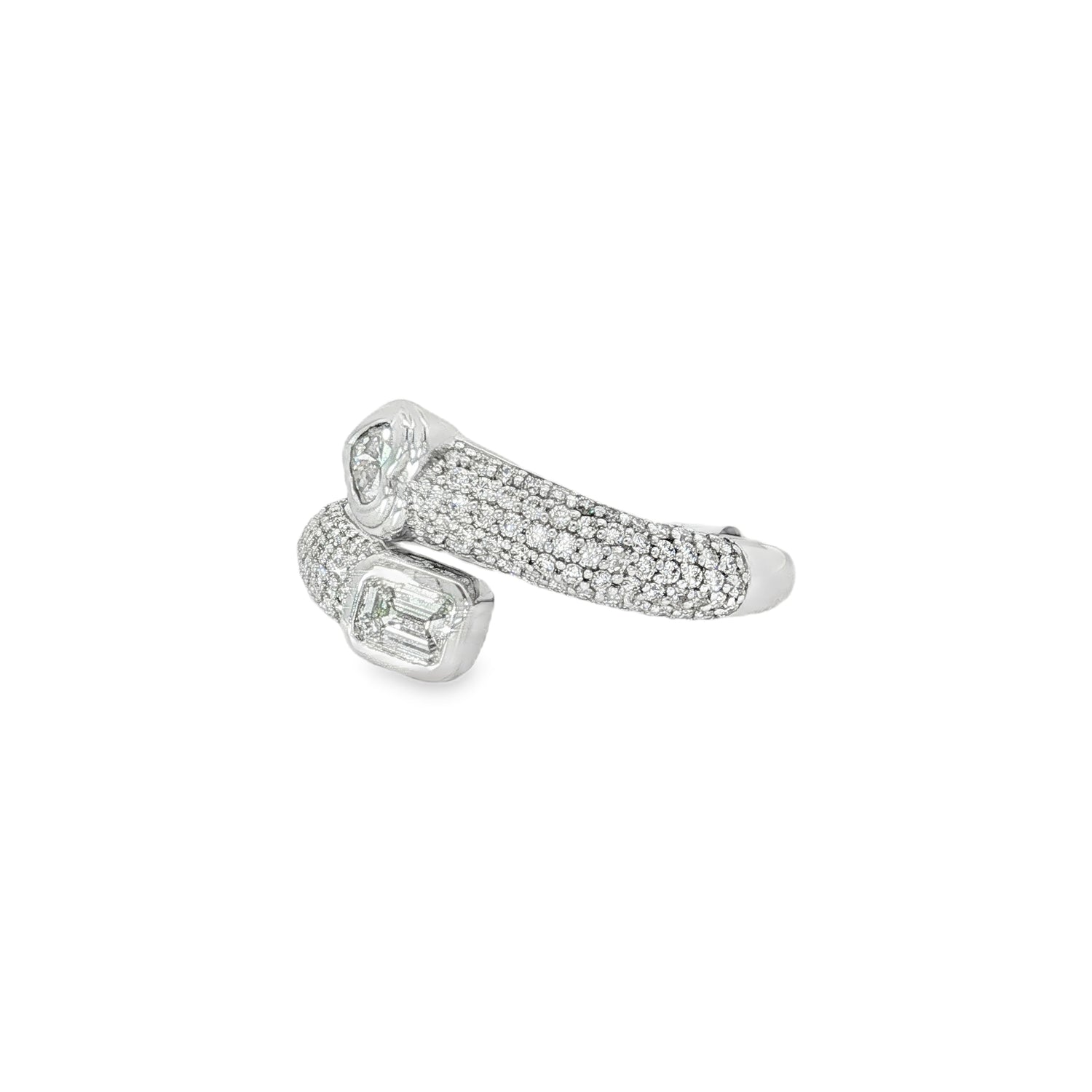 Angled view of pavé bands and opposing heart and emerald-cut diamonds