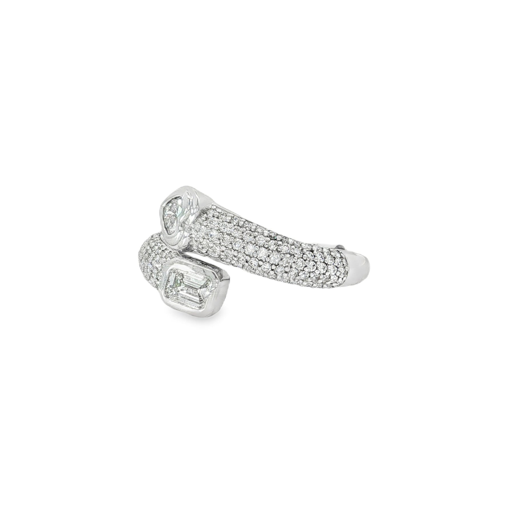 Angled view of pavé bands and opposing heart and emerald-cut diamonds