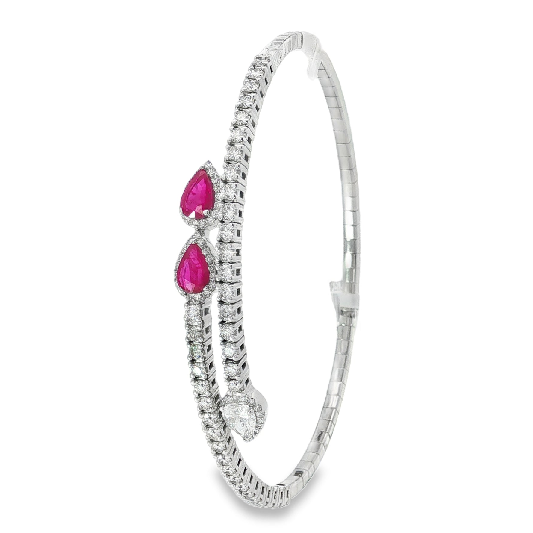 Side view showing pear rubies and diamond-set open bangle ends