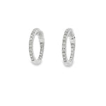 White gold hoop earrings with round diamonds along front and inner curves