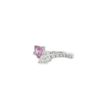 Side view of pink sapphire and pear diamond ring showing raised settings