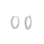 White gold oval hoop earrings with a single front row of round diamonds