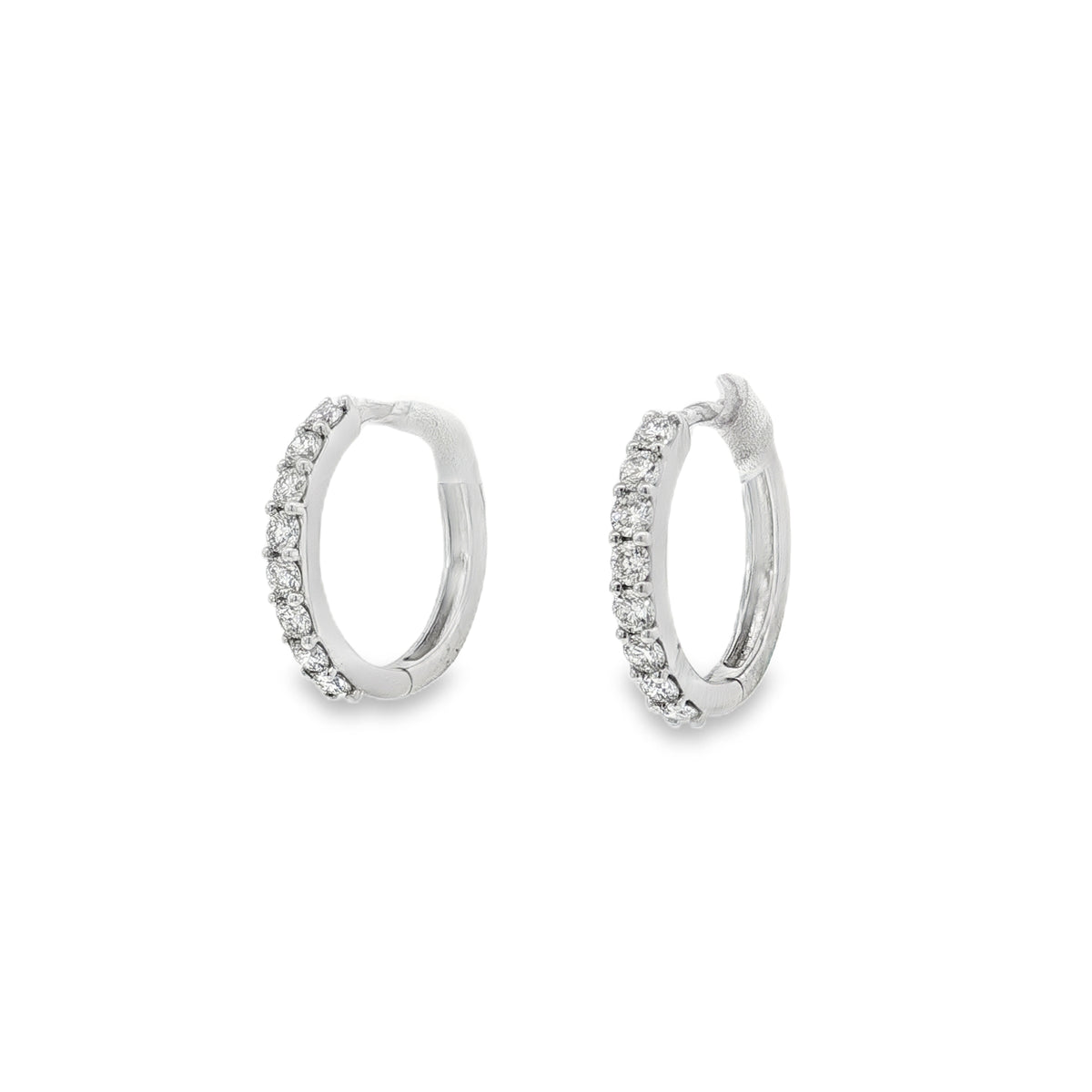 White gold oval hoop earrings with a single front row of round diamonds