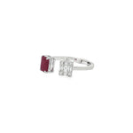 Angled view of ruby and baguette diamond duo ring showing the open band