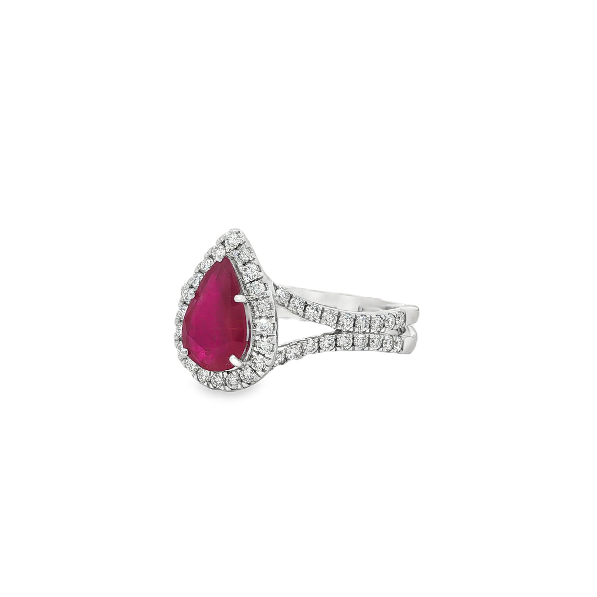 Angled view of pear ruby halo ring showing raised setting and split diamond band