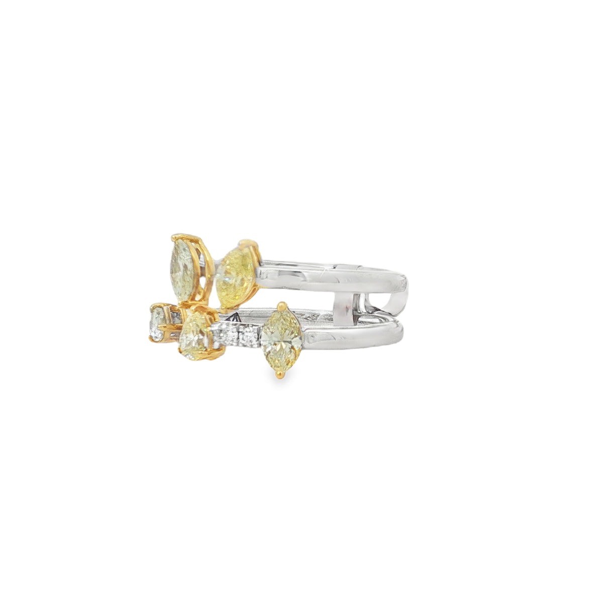 Side view of two-tone diamond ring showing raised pear and marquise settings