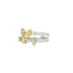 Side view of two-tone diamond ring showing raised pear and marquise settings