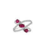 White gold spiral ring with three rubies and sweeping diamond-set bands