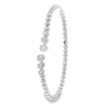 Side view of white gold beaded bangle showing separated diamond-set ends