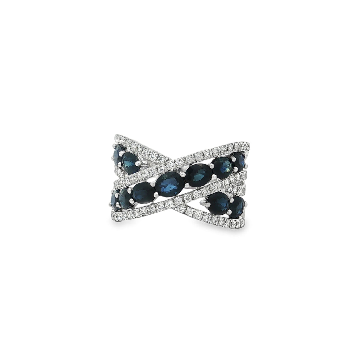 White gold crisscross ring with rows of oval sapphires between diamond borders