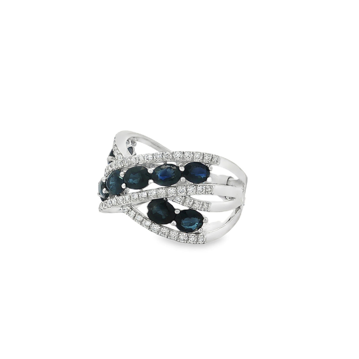 Angled view of sapphire crisscross ring showing open spaces between diamond-lined bands