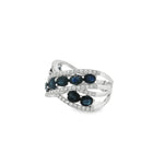 Angled view of sapphire crisscross ring showing open spaces between diamond-lined bands