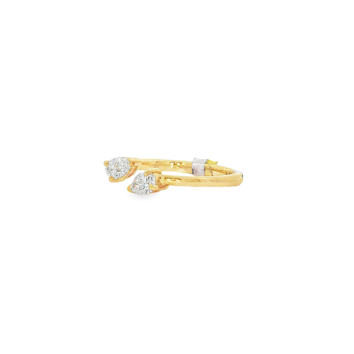 Angled view of yellow gold twin pear diamond ring showing raised settings
