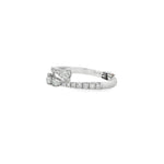 Side view of graduated pear diamond bypass ring showing the open gap and raised settings