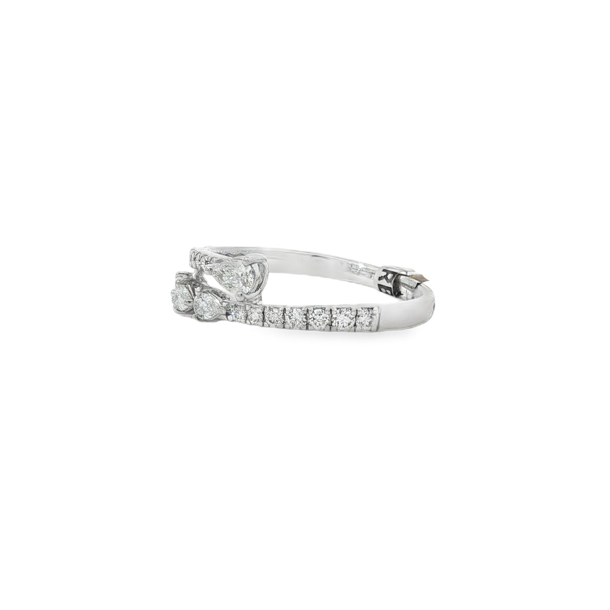 Side view of graduated pear diamond bypass ring showing the open gap and raised settings