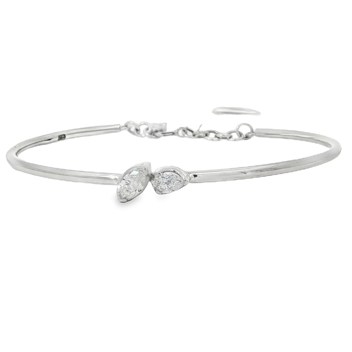 White gold bangle with pear and marquise diamonds on a slender polished band