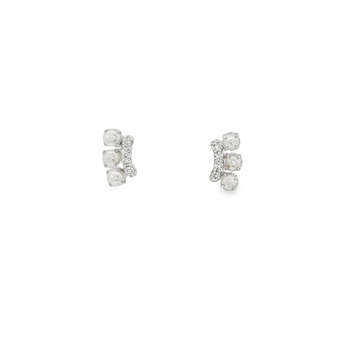 White gold earrings with three pearls beside curved bars of round diamonds