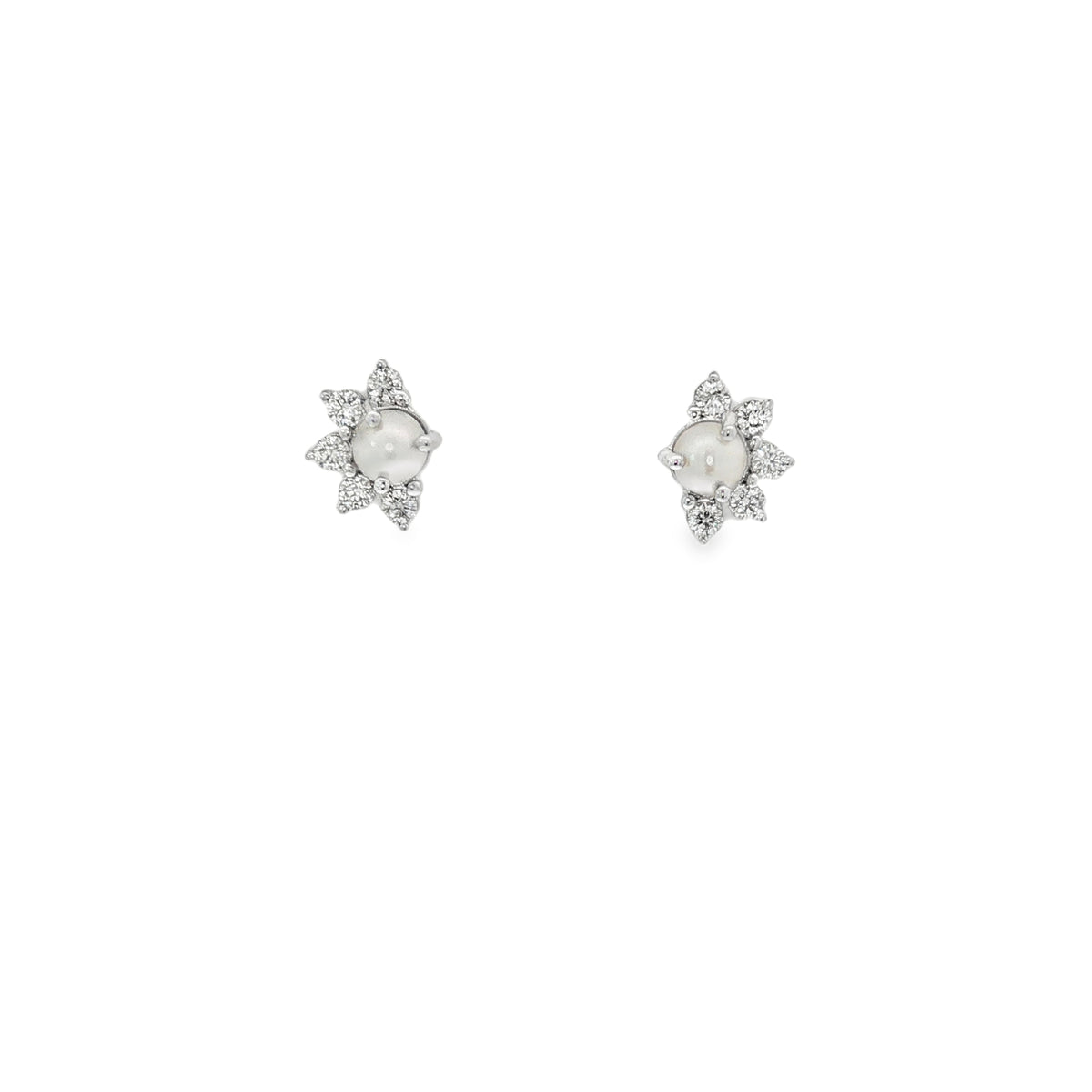 White gold star stud earrings with pearl centers and diamond-set pointed surrounds