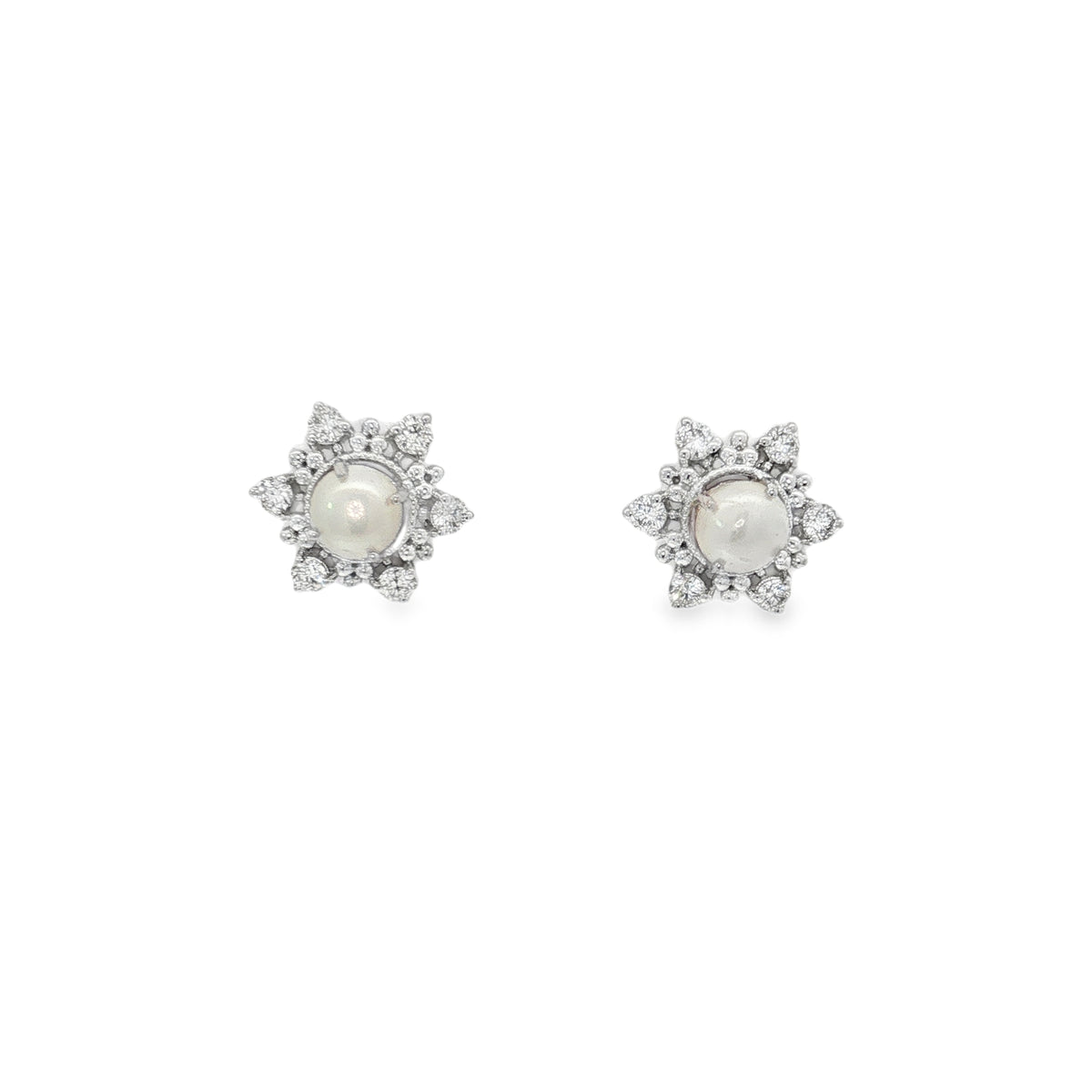 White gold rosette stud earrings with pearl centers and radiating diamond surrounds