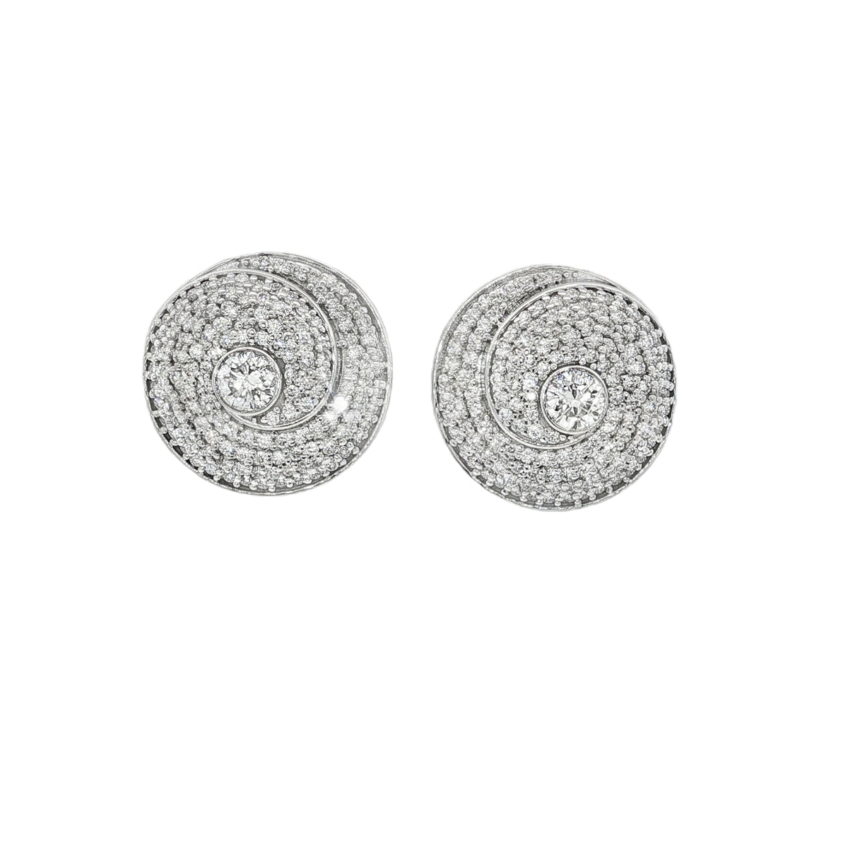 White gold disc stud earrings with spiral pavé patterns and larger focal diamonds