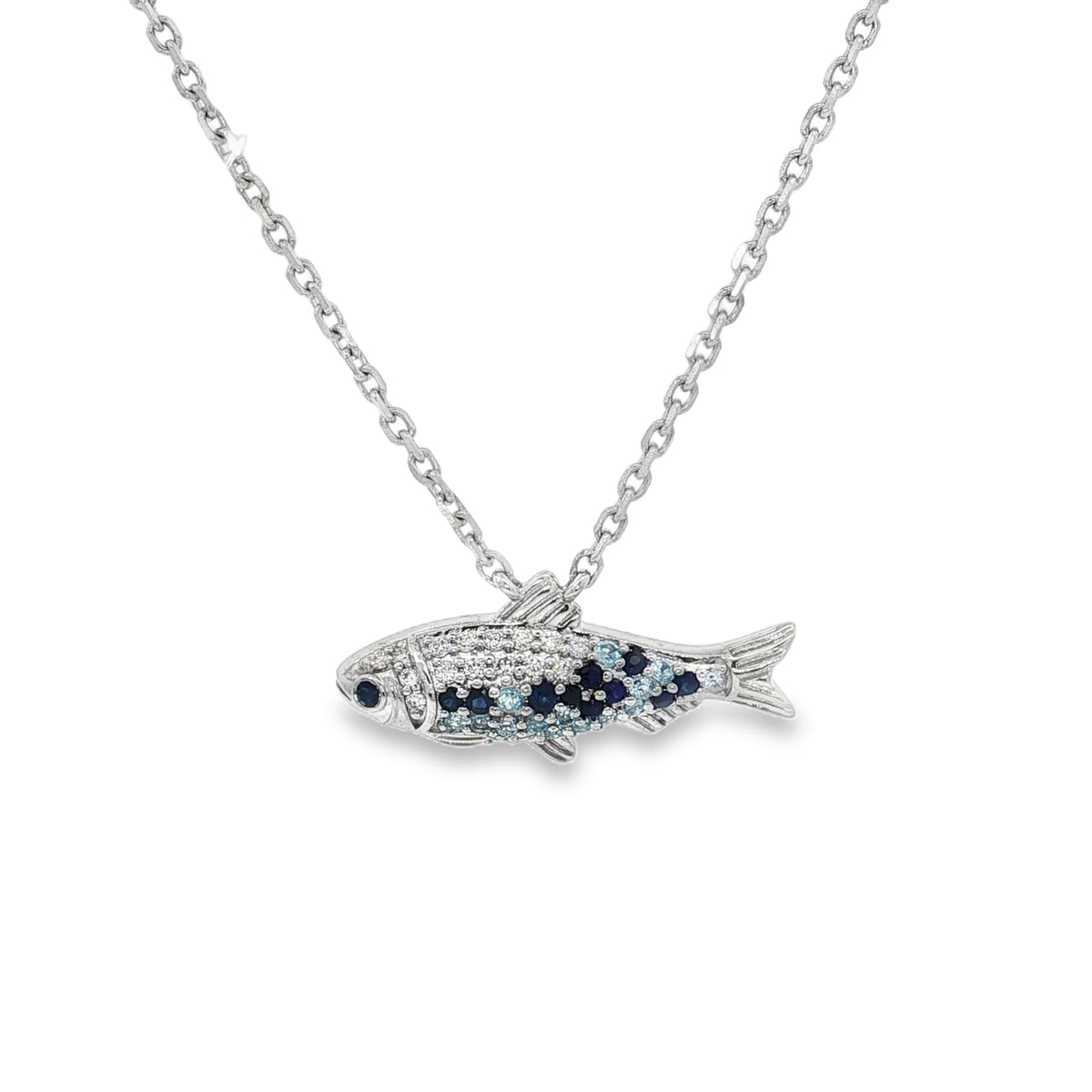 White gold fish necklace with sapphire, blue topaz and diamond details across its body