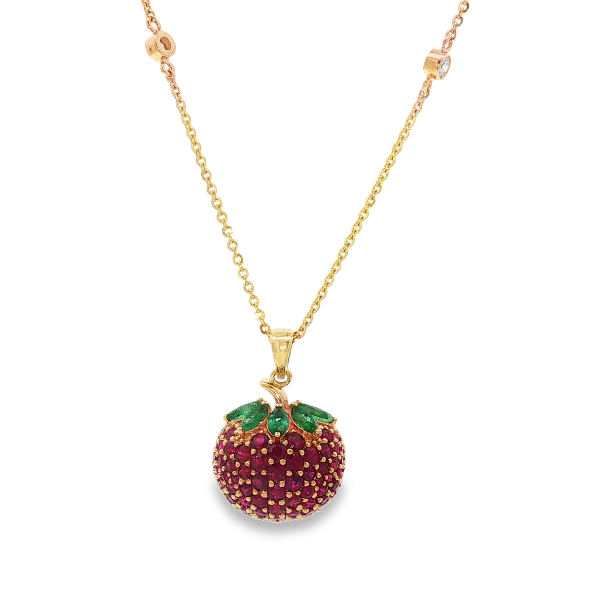 Yellow gold strawberry necklace with ruby fruit, emerald leaves and diamond chain accents