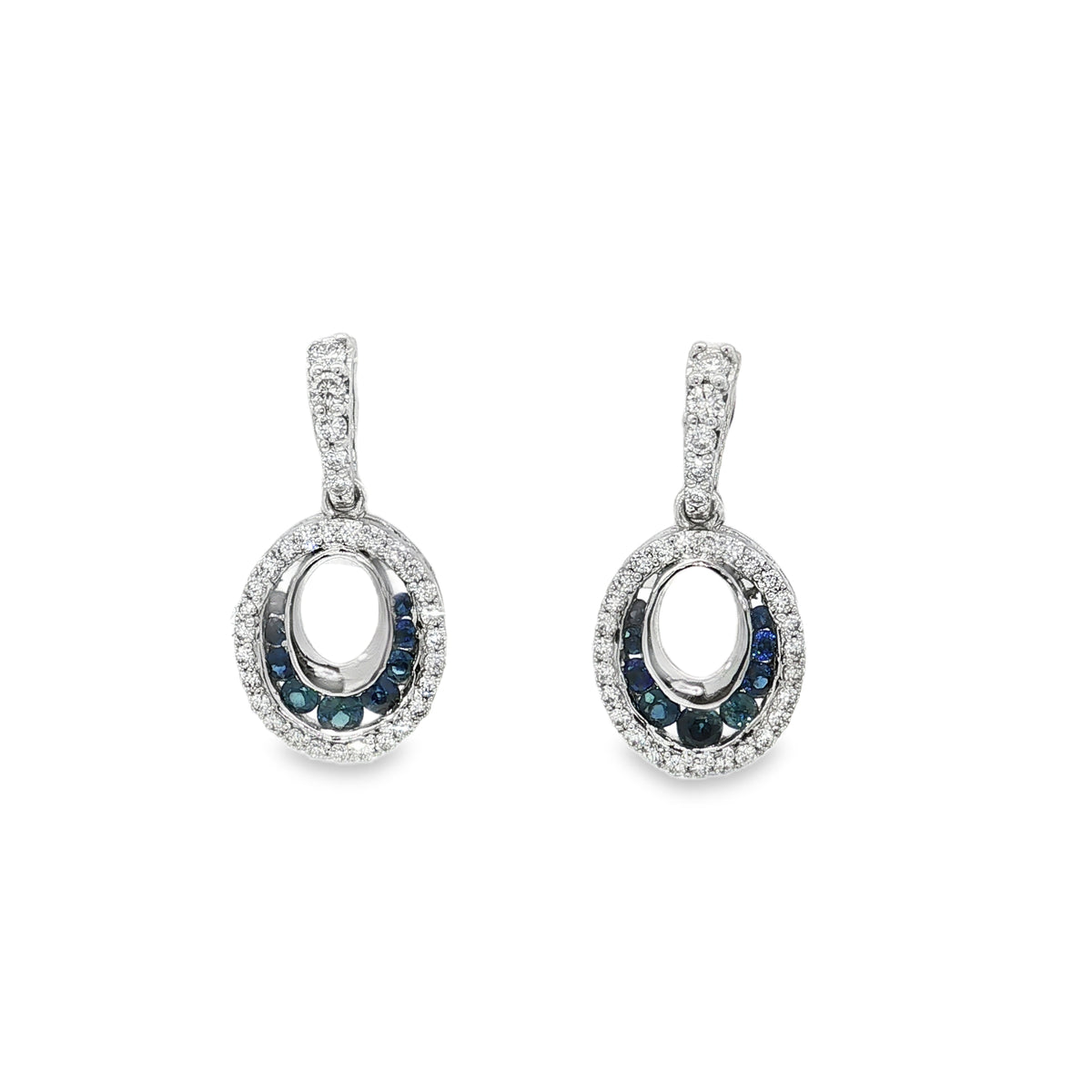 White gold dangle earrings with open oval frames, sapphire accents and round diamonds