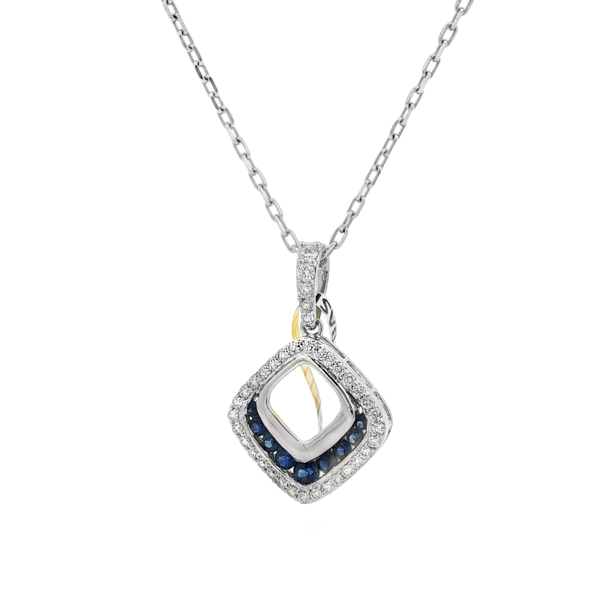 White gold open-lozenge pendant with blue sapphire accents and a diamond-set outer frame