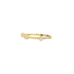 Angled view of yellow gold twisted band and raised round diamond bezels