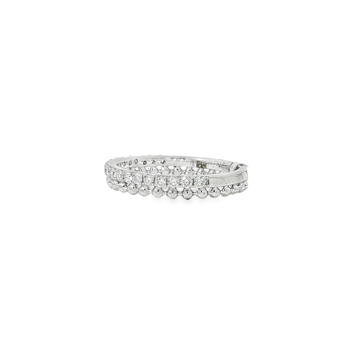 Angled view of diamond-set band showing the rounded bead detailing along one edge