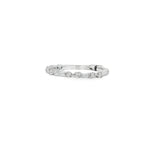 Angled view showing alternating baguette diamonds and rounded clusters along the slim band